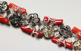 A SILVER, CORAL AND MOTHER-OF-PEARL BRACELET. 7.5ins long.