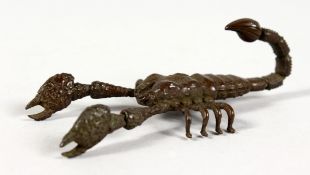 A SMALL JAPANESE BRONZE ARTICULATED SCORPION. 3.5ins long.