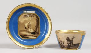 A VIENNA BLUE CUP AND SAUCER, with sepia panels of birds and animals. Mark in blue.