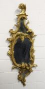 A GOOD CHIPPENDALE CARVED AND GILDED ROCOCO DESIGN MIRROR with scrolls and foliage. 4ft 10ins high x