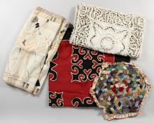 A BAG OF OLD TEXTILES.