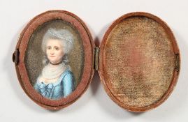 A SMALL 18TH CENTURY OVAL PORTRAIT MINIATURE OF A LADY. 2ins x 1.5ins, in a velvet case.