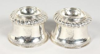 A PAIR OF VICTORIAN BRITANNIA STANDARD SILVER SALT CELLARS of Queen Anne design with gadrooned edge,