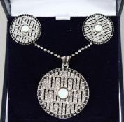 A SILVER AND OPAL SET DECO STYLE TARGET PENDANT AND EARRINGS.