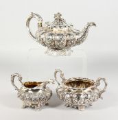 A WILLIAM IV SILVER TEAPOT AND SUGAR BASIN, repousse with acanthus and flowers on shell and acanthus