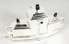 AN ART DECO STYLE PLATED THREE-PIECE TEA SET ON STAND. 15ins long.