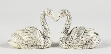 A PAIR OF .925 SILVER SWANS SALT AND PEPPER.