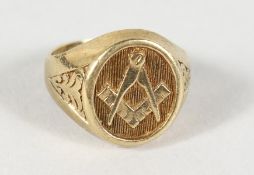 A 9CT GOLD MASONIC RING.