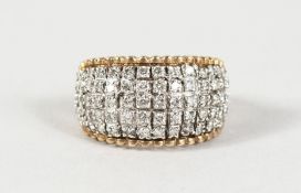 A 9CT GOLD FIVE-ROW DIAMOND RING.