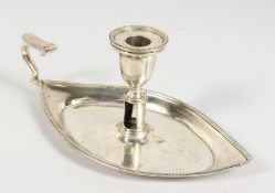 A BOAT SHAPED CHAMBER CANDLESTICK. Bears crest of The Barings Family.