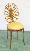 A DECORATIVE WROUGHT IRON CHAIR, gilt decorated with a wheatsheaf oval back.