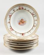 A SUPERB SET OF SIX MEISSEN PORCELAIN CAPODIMONTE DESIGN PLATES, the centres painted with cupids,
