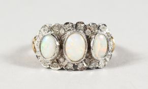 A GOOD 9CT GOLD, DIAMOND AND OPAL RING.