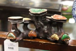 A Chinese bronze and hardstone brush rest of naturalistic form.