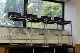 A set of four bar stools.