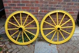 A large pair of painted cartwheels.