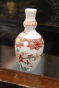 A good Chinese Famille Rose porcelain double gourd snuff bottle.