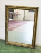A decorative gilt framed mirror.