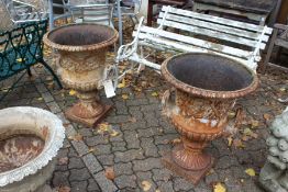 A good large pair of cast iron campagna shaped garden urns.