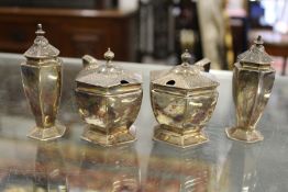 A silver four-piece cruet set.