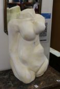 A painted pottery abstract female torso.