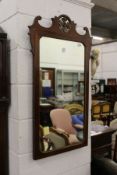 A George III style inlaid mahogany fretwork framed wall mirror.