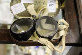 A cased set of 1940's driving glasses.