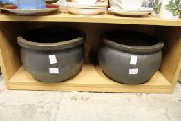 A pair of plant pots.