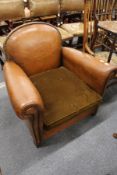 A 1930's leather upholstered club style armchair.