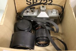 A Praktica 35mm camera with various lenses.