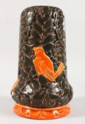 A Czechoslovakian pottery vase with relief mould decoration.