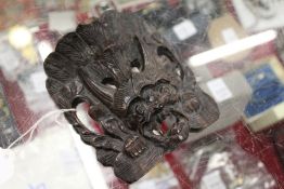 A small eastern carved hardwood mask.