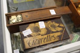 A box of old ebony and bone dominoes together with a poker work cigarette box.