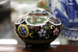 A small cloisonné pot and cover.