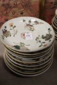 Ten Chinese floral decorated saucer dishes.