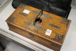 An oak and brass cigarette / cigar box containing bijouterie etc.