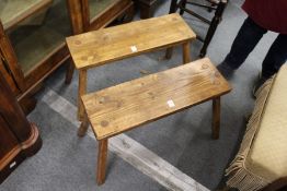A pair of small pine benches.