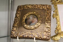 A small gilt framed enamel plaque.
