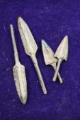 A group of four early bronze spear or arrow tips.