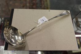 A George III silver ladle.