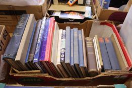 A box of art and antique reference books.