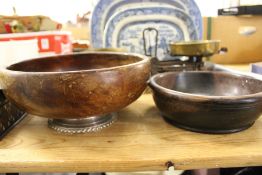 A turned wood bowl with sterling silver foot together with another plain wooden bowl.
