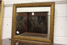 A small gilt framed mirror.