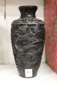 A Chinese cinnabar lacquer style vase.