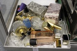 A quantity of perfume bottles, lipsticks etc.