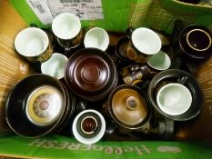A quantity of Denby style dark brown glazed earthenware dinner ware coffee cups and saucers etc.