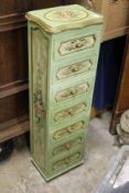 A painted narrow chest of drawers.