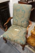 A George III style mahogany framed open armchair on cabriole legs.