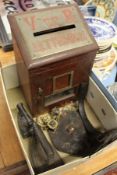A Victorian letter box, horse brasses and flat irons.