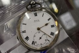 A silver pocket watch.